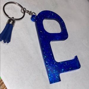 Social distancing door opener with tassel